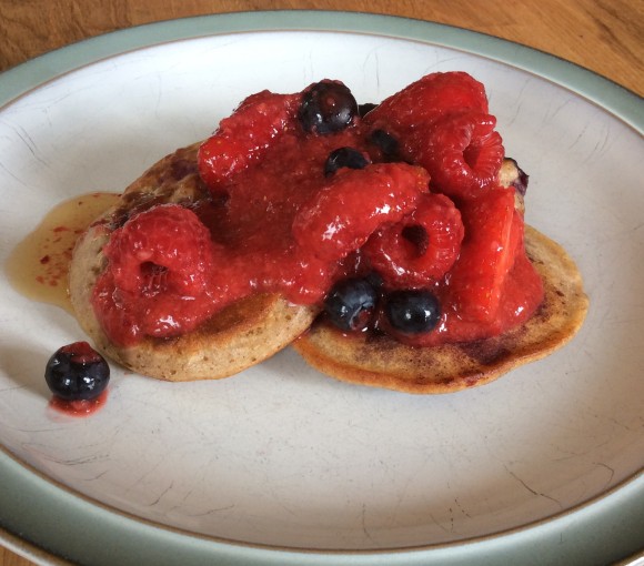 Gluten free blueberry pancakes with berry sauce